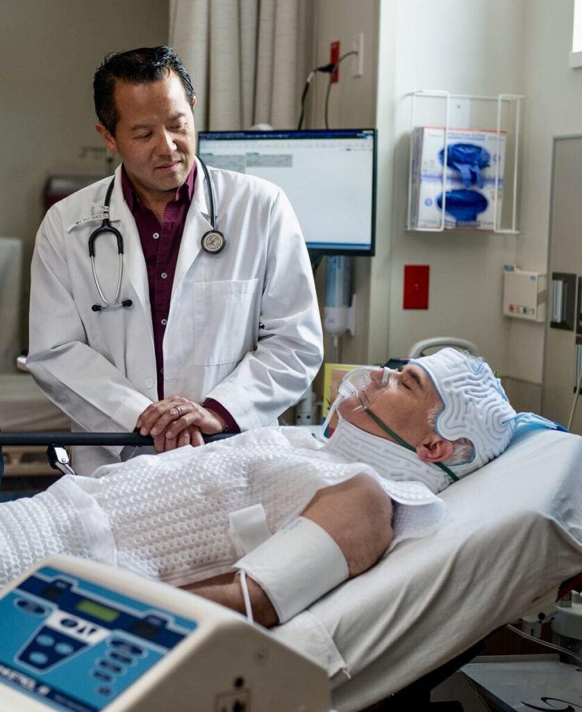 Patient on Blanketrol III with doctor standing by