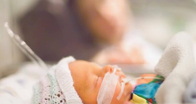 Baby in hospital using Zopec medical transport batteries to power equipment