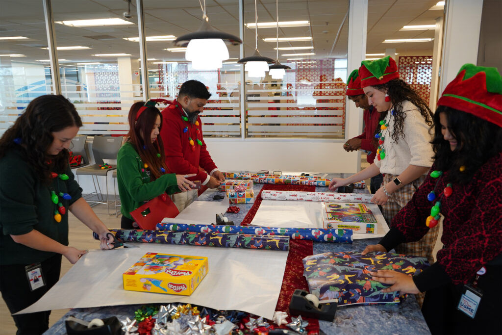 Top Workplace Converted to Santa’s Workshop on Giving Tuesday to Spread ‘Big Love’ This Holiday Season 1 USME Elves Wrapping Presents for B.I.G. Love